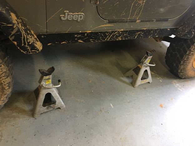 We initially used jack stands to support the side steps during marking the holes to be drilled
